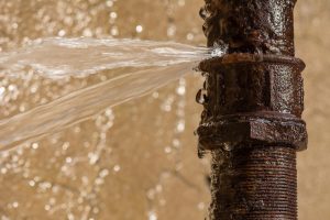 rusty pipe leaking water